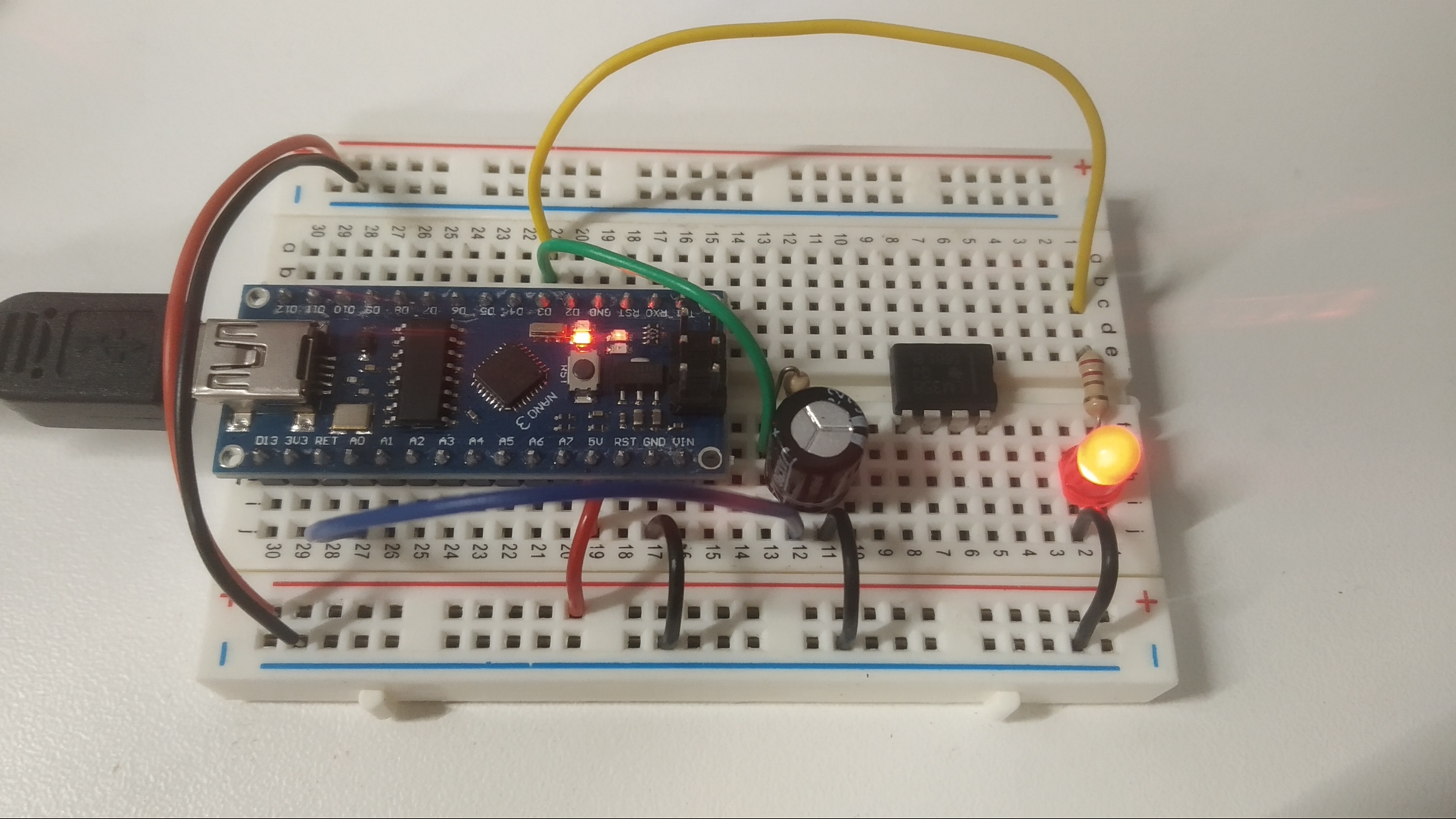 Breadboard circuit with Arduino generating a square wave output that drives an RC network.