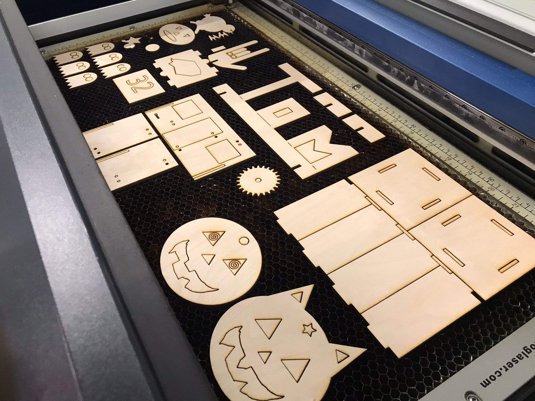 The final cut pieces on the bed of the laser cutter